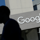 A man walking past a building at Google’s Mountain View, California headquarters in 2015.